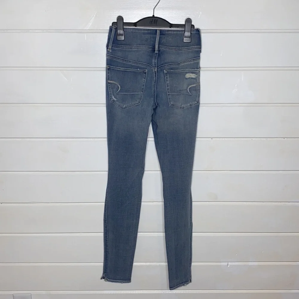 American Eagle super hi rise distressed skinny jeans